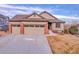 Charming single-Gathering home featuring a two-car garage, brick accents, and well-maintained landscaping at 1339 Bent Grass Cir, Castle Rock, CO 80109