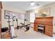 This home gym features both weight lifting and rowing equipment, as well as a wooden roll-top desk at 1339 Bent Grass Cir, Castle Rock, CO 80109