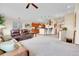 Open living room with a large peninsula bar looking into the kitchen at 1339 Bent Grass Cir, Castle Rock, CO 80109