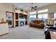 Bright living room with built-in shelving around a fireplace and large windows with mountain views at 1339 Bent Grass Cir, Castle Rock, CO 80109