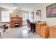 Bright home office featuring carpet, a ceiling fan, a wooden roll-top desk, and additional wood workstations at 1339 Bent Grass Cir, Castle Rock, CO 80109