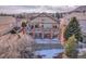 Two story home with deck and brick pillars in a mature neighborhood at 1339 Bent Grass Cir, Castle Rock, CO 80109