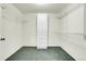 Walk-in closet features neutral paint, carpet, and an adjustable shelving and drawer system at 1339 Bent Grass Cir, Castle Rock, CO 80109