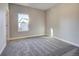 Neutral bedroom with carpeted floors, light gray walls and a double-hung window at 17220 Snowwood Dr, Monument, CO 80132