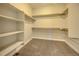 This walk-in closet features sturdy shelving and plush carpeting at 17220 Snowwood Dr, Monument, CO 80132