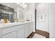 Modern bathroom featuring double sinks, stylish lighting, and a sleek design at 18129 E 99 Pl, Commerce City, CO 80022