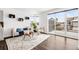 Bright living room with a sliding glass door leading to a patio or balcony at 18129 E 99 Pl, Commerce City, CO 80022