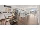 Open-concept living space with a modern kitchen, dining area, and living room at 18129 E 99 Pl, Commerce City, CO 80022