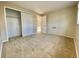 Neutral bedroom features carpet, closet with sliding doors, and a view to a hallway at 1243 Gaylord St # 302, Denver, CO 80206
