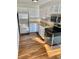 Charming kitchen featuring stainless steel appliances, bright cabinets, and updated flooring at 1243 Gaylord St # 302, Denver, CO 80206
