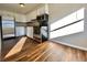 Modern kitchen with stainless steel appliances, new flooring, and plenty of countertop space at 1243 Gaylord St # 302, Denver, CO 80206