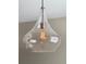 Close-up of a stylish pendant light fixture with a glass shade, enhancing the room's ambiance at 1243 Gaylord St # 302, Denver, CO 80206