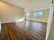 Bright living room featuring hardwood floors and natural light from a double window at 1243 Gaylord St # 302, Denver, CO 80206