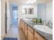 Bathroom featuring double sinks with granite counters, and tile floors, providing a touch of elegance at 3100 Blue Sky Cir # 205, Erie, CO 80516