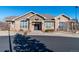 Community clubhouse featuring stone accents, arched windows, and a welcoming entrance at 3100 Blue Sky Cir # 205, Erie, CO 80516