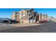 Apartment complex with garage, parking lot, and well-maintained landscaping at 3100 Blue Sky Cir # 205, Erie, CO 80516