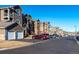 Attractive exterior view of a multi-story apartment building with ample parking at 3100 Blue Sky Cir # 205, Erie, CO 80516