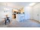 Eat-in kitchen area with granite countertops and ample space at 3100 Blue Sky Cir # 205, Erie, CO 80516