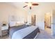 Inviting main bedroom with walk-in closet, ceiling fan and neutral decor, creating a comfortable and relaxing space at 3100 Blue Sky Cir # 205, Erie, CO 80516