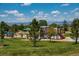 Lush community playground with scenic mountain views, featuring slides, swings and picnic gazebo at 3100 Blue Sky Cir # 205, Erie, CO 80516