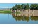 Scenic view of the Vista Ridge community entrance sign reflected in the tranquil pond at 3100 Blue Sky Cir # 205, Erie, CO 80516