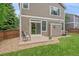 Cozy backyard patio with seating area and well-maintained lawn and rock landscaping at 3860 Mallard Dr, Highlands Ranch, CO 80126