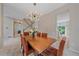 Elegant dining room with a stylish light fixture and seating for six, perfect for gatherings at 3860 Mallard Dr, Highlands Ranch, CO 80126
