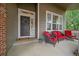 Cozy front porch with comfortable seating, stylish decor, and a welcoming entrance at 3860 Mallard Dr, Highlands Ranch, CO 80126