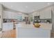 Well-lit kitchen with quartz countertops, stainless steel appliances, and ample cabinet space at 3860 Mallard Dr, Highlands Ranch, CO 80126