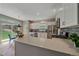 Modern kitchen featuring sleek white cabinets, stainless steel appliances, and a large island with quartz countertop at 3860 Mallard Dr, Highlands Ranch, CO 80126