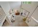 Bright and airy living room featuring vaulted ceilings, large windows, and a stylish chandelier at 3860 Mallard Dr, Highlands Ranch, CO 80126
