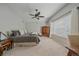 Calm bedroom featuring a ceiling fan, and a large window with blinds and curtains at 3860 Mallard Dr, Highlands Ranch, CO 80126