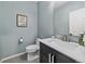 Stylish powder room with modern fixtures, a sleek vanity, and a contemporary design at 3860 Mallard Dr, Highlands Ranch, CO 80126