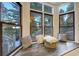 Inviting bay window seating area with comfortable cushions and a view of the outdoors at 6857 Timbers Drive, Evergreen, CO 80439