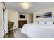 Comfortable bedroom with a plush bed and scenic artwork, creating a peaceful retreat at 6857 Timbers Drive, Evergreen, CO 80439