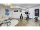 Home gym and sitting area with natural light and essential equipment, promoting a healthy lifestyle at 6857 Timbers Drive, Evergreen, CO 80439