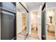 Bright bathroom features a shower-tub combo, updated vanity, and access to a convenient closet at 13890 E Marina Dr # 107, Aurora, CO 80014