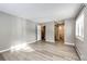 Bright bedroom with hardwood floors, closet, and attached bathroom at 13890 E Marina Dr # 107, Aurora, CO 80014