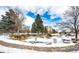 Community features a pond and trees, partially covered in snow at 13890 E Marina Dr # 107, Aurora, CO 80014