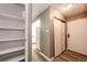 Entryway featuring hardwood floors, a closet, and a view into the kitchen area at 13890 E Marina Dr # 107, Aurora, CO 80014