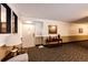 Hallway with carpet, neutral paint, and decorated table at 13890 E Marina Dr # 107, Aurora, CO 80014