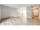 Light-filled living room with wood-look floors and access to balcony at 13890 E Marina Dr # 107, Aurora, CO 80014