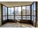 This is an enclosed sunroom featuring large windows offering an abundance of natural light and neighborhood views at 13890 E Marina Dr # 107, Aurora, CO 80014