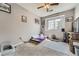 Cozy bedroom featuring natural light, ceiling fan, and a minimalist mattress on the floor at 3262 E 103Rd Dr # 1810, Thornton, CO 80229