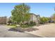 A serene view of well-maintained townhomes with manicured lawns and tree-lined streets at 3262 E 103Rd Dr # 1810, Thornton, CO 80229