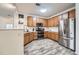 Well-equipped kitchen featuring stainless steel appliances, and wooden cabinets at 3262 E 103Rd Dr # 1810, Thornton, CO 80229