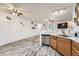 Bright kitchen with stainless steel appliances, a breakfast bar, and an open floor plan at 3262 E 103Rd Dr # 1810, Thornton, CO 80229
