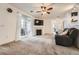 Spacious living room with fireplace, sliding glass door, plush carpet, and comfortable seating at 3262 E 103Rd Dr # 1810, Thornton, CO 80229
