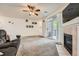 Inviting living room with a fireplace, sliding glass door, and cozy seating area at 3262 E 103Rd Dr # 1810, Thornton, CO 80229