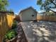 Backyard patio with planting beds and privacy fence, ideal for outdoor enjoyment at 3440 W 33Rd Ave, Denver, CO 80211